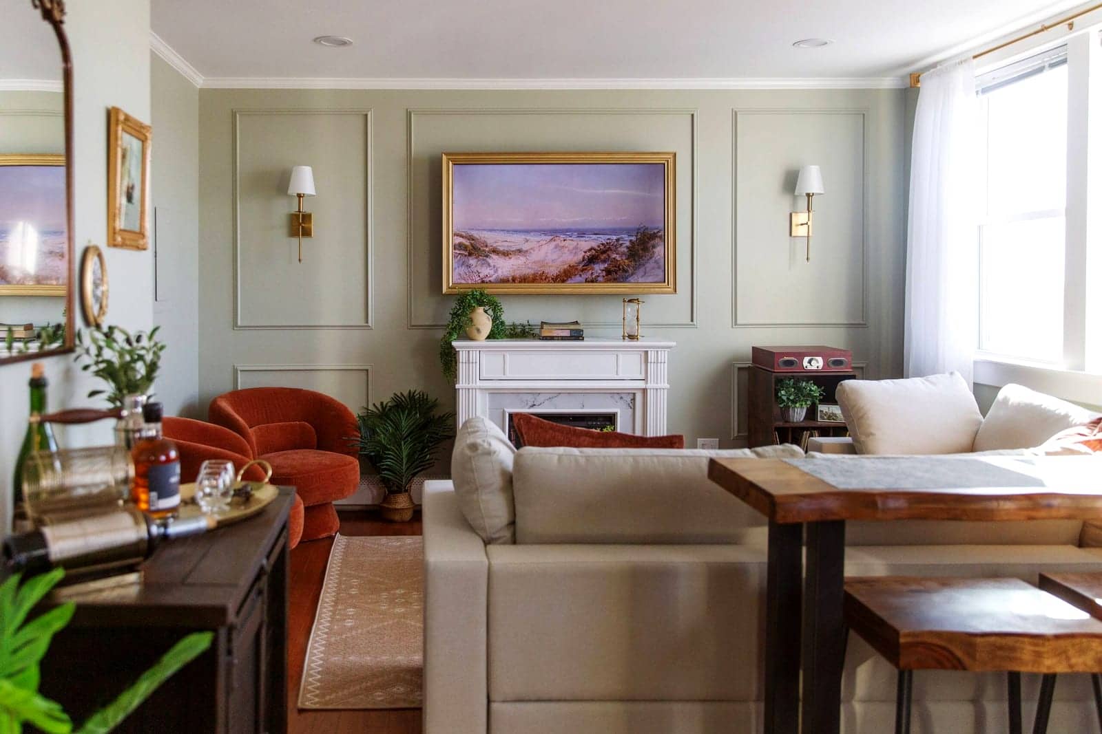 A Boost-managed living room — panelled walls, fireplace and framed art